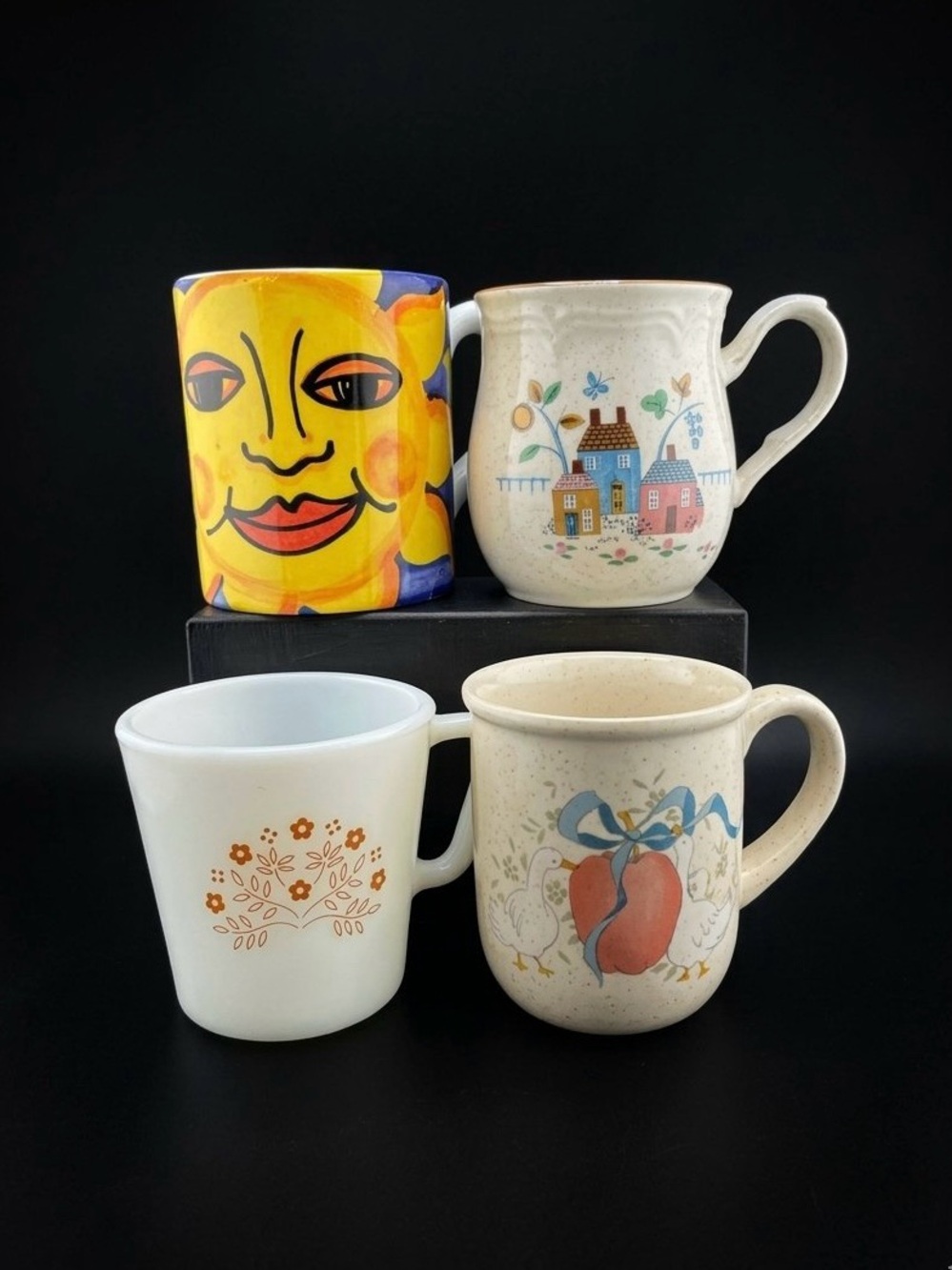 Set of 4 collectible vintage coffee mugs.